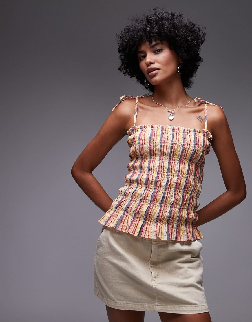 Model wearing a plaid printed cami top