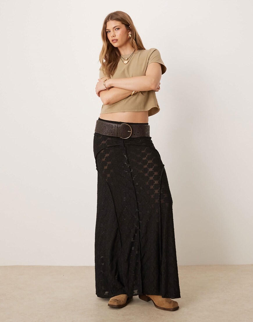 Model wearing a black maxi skirt