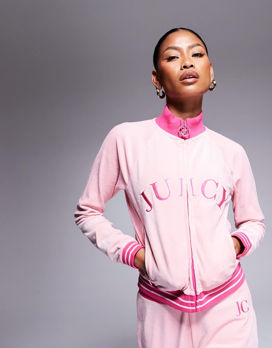 Model wearing pink Juicy Couture tracksuit