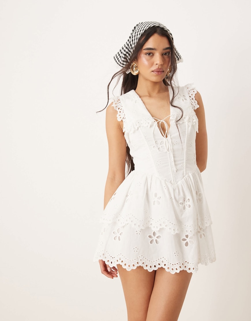 Woman wearing white milkmaid dress