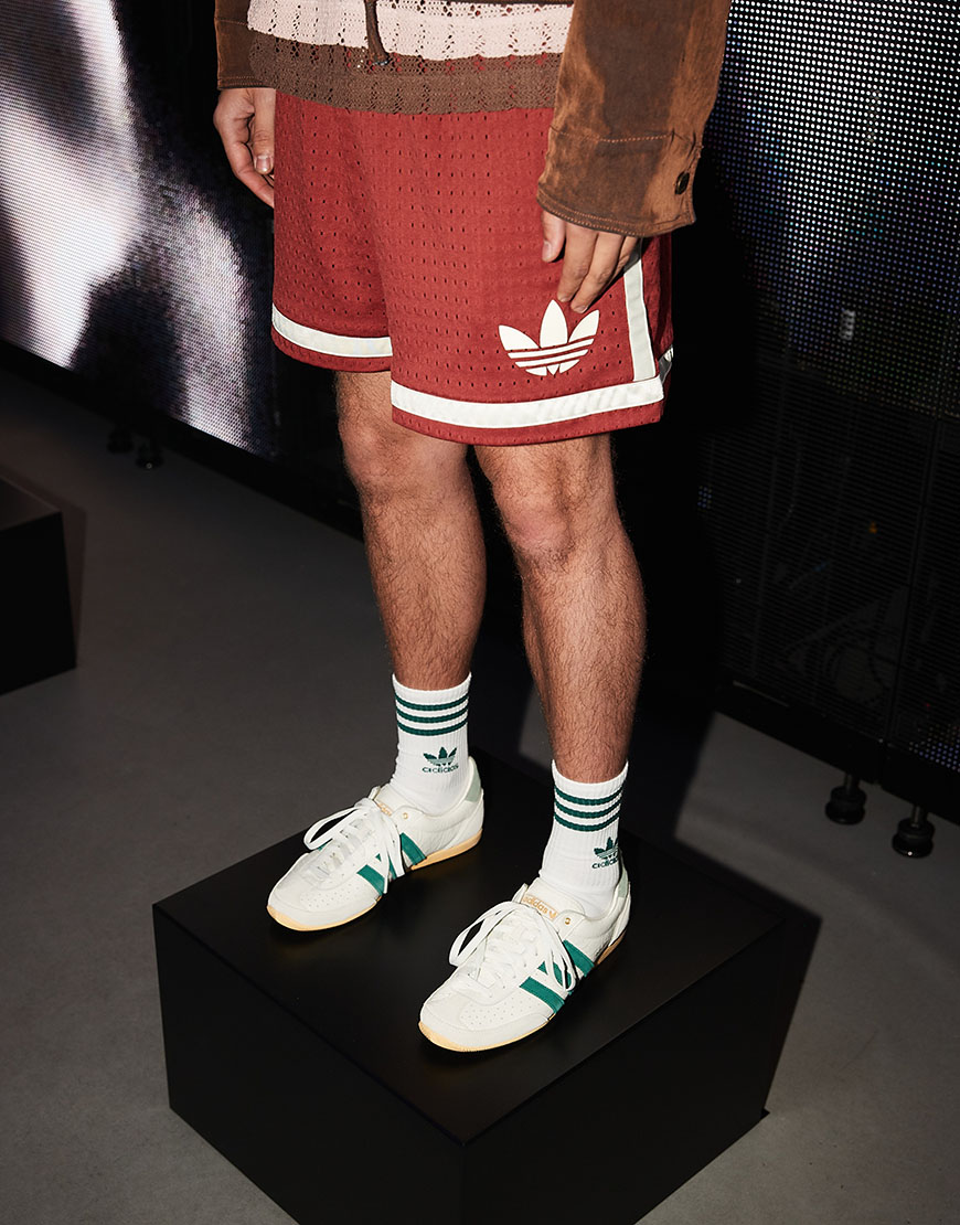 Man wearing red adidas Originals shorts and Japan sneakers | ASOS Style Feed