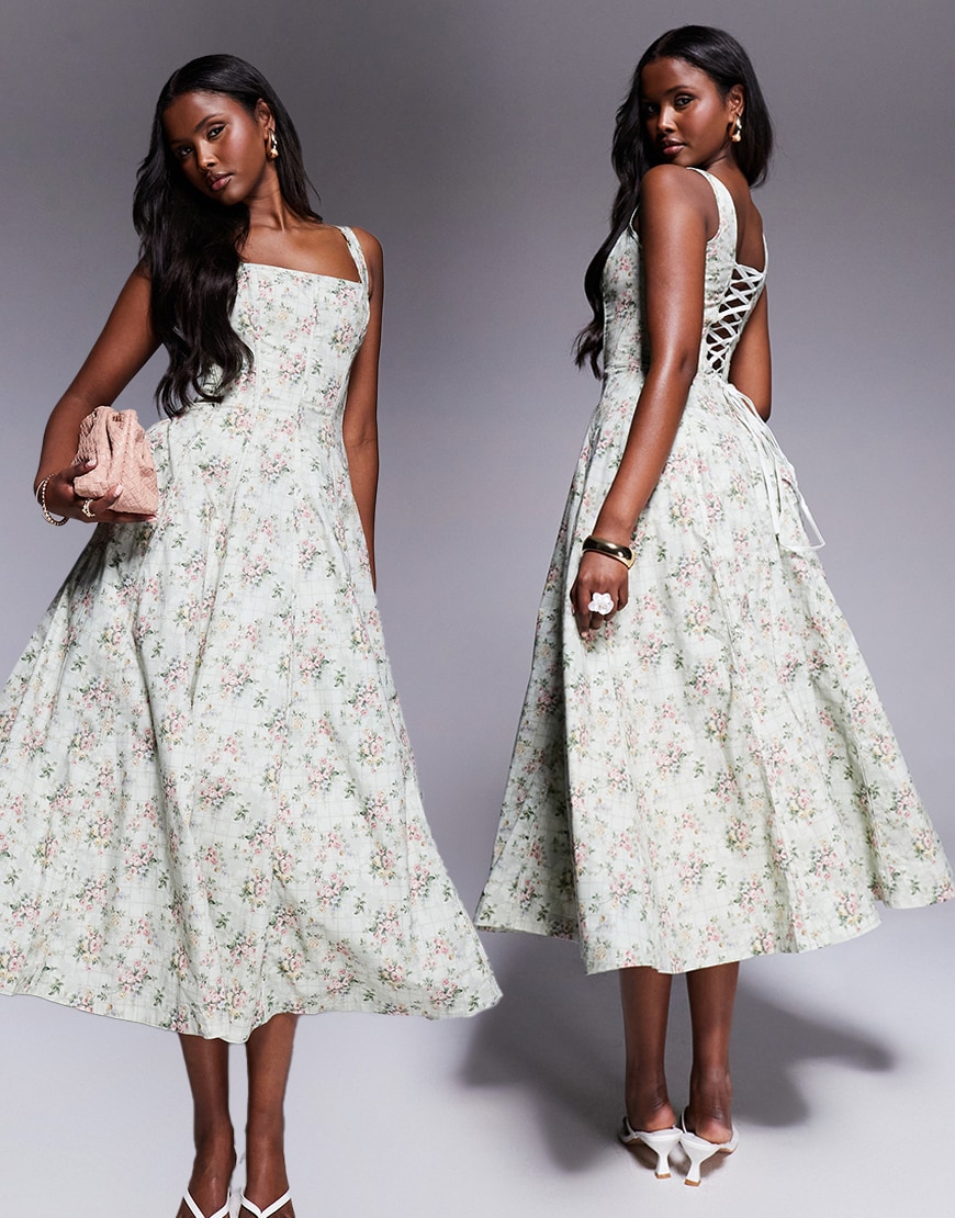 Model wearing a green floral dress