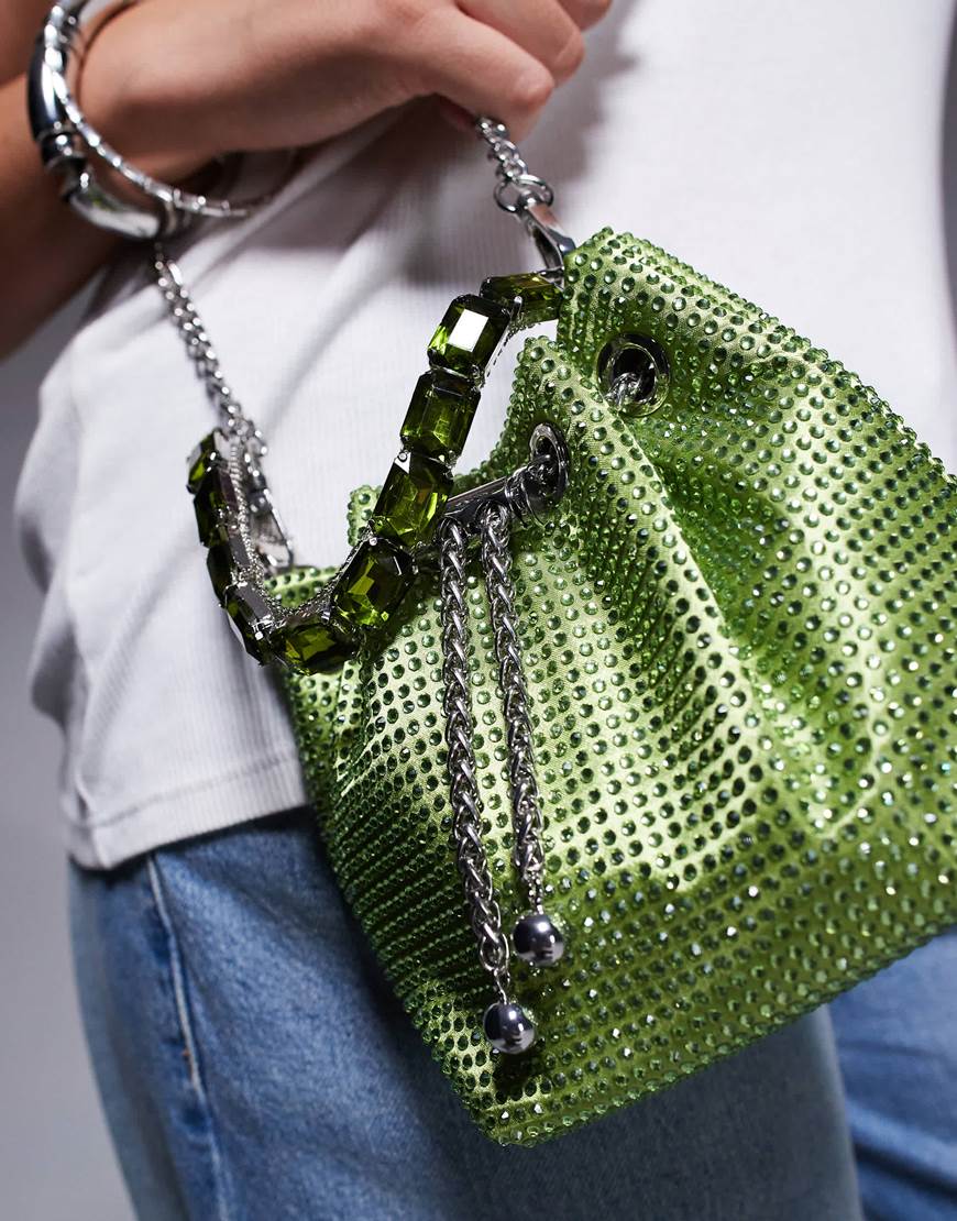 A model holding an embellished dill green bag | ASOS Style Feed