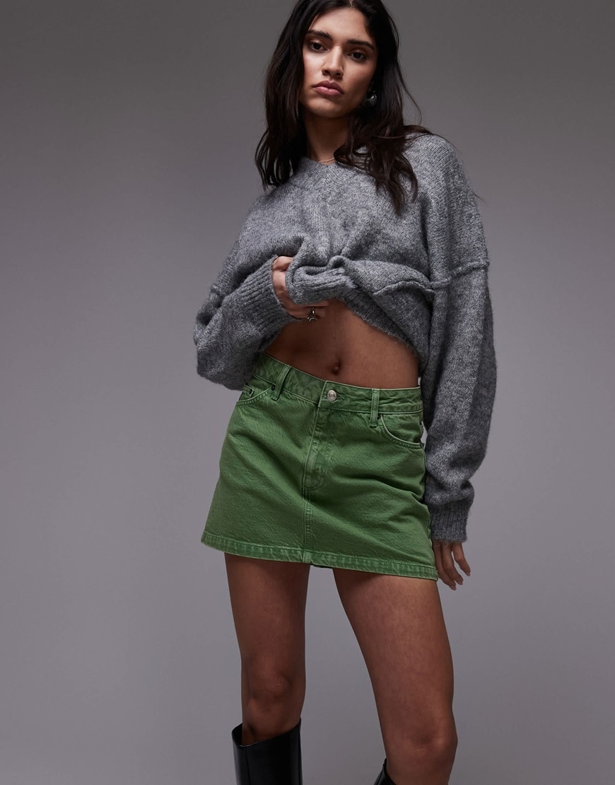 A model wearing a denim mini skirt in dill green | ASOS Style Feed