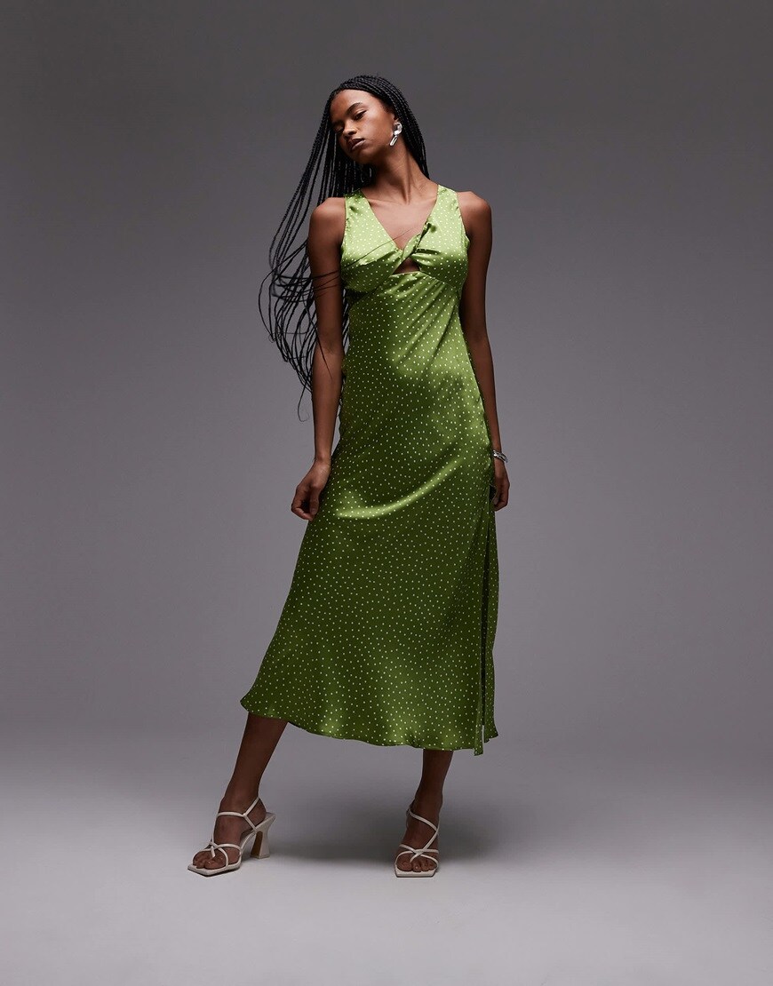A model wearing a silk spotted dill green dress | ASOS Style Feed