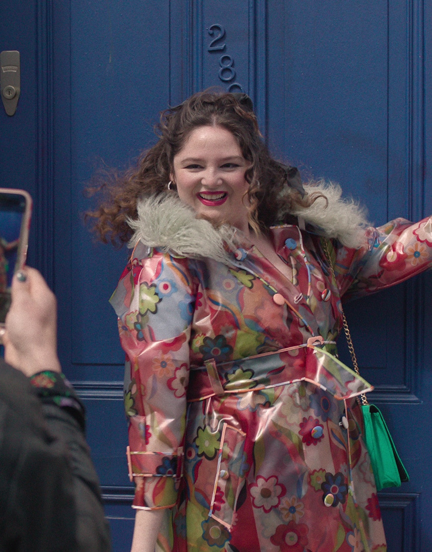 Jessica (Megan Stalter) wearing bold coat in Too Much Netflix series | ASOS Style Feed