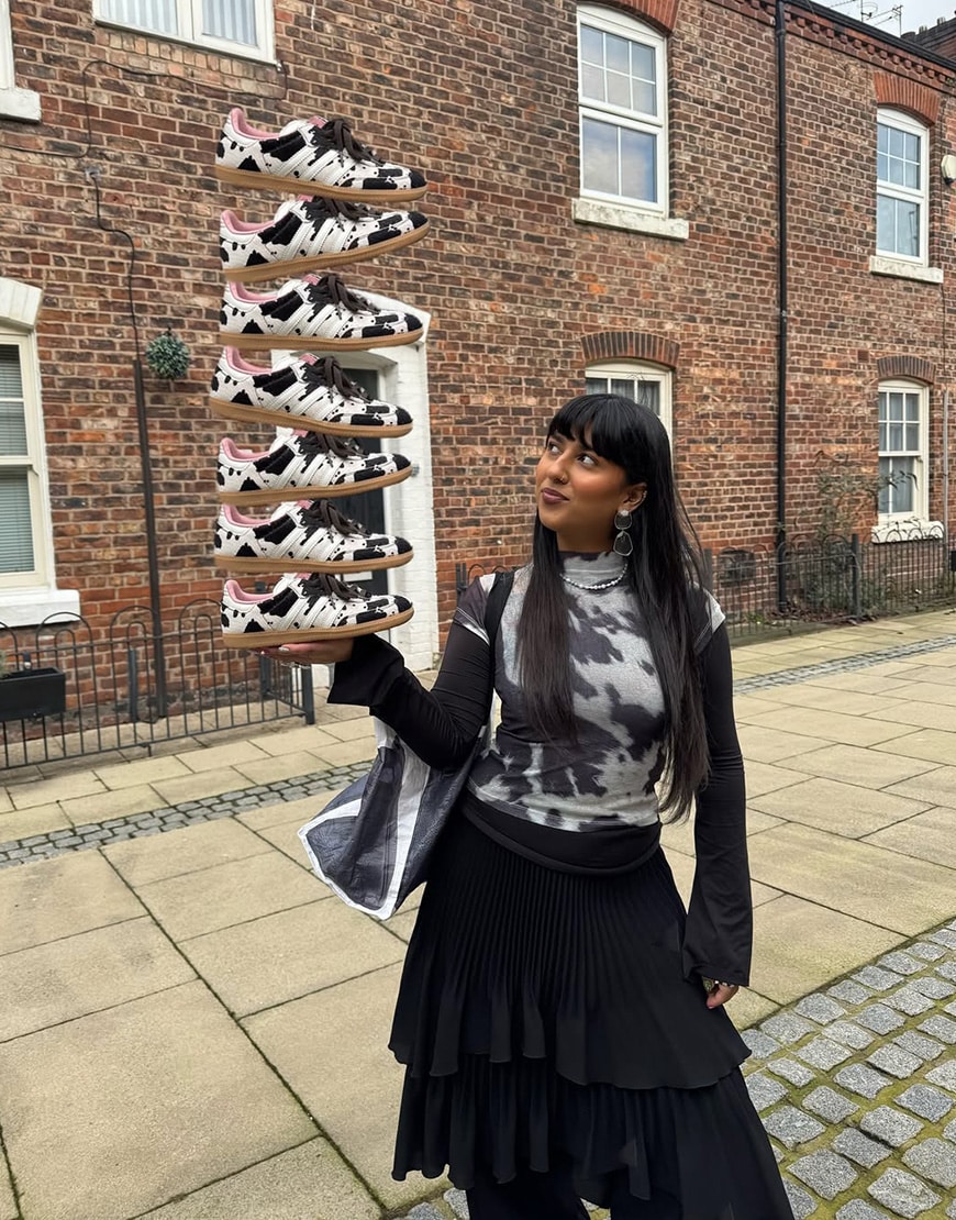 Woman wearing black maxi skirt and adidas cow print Samba | ASOS Style Feed