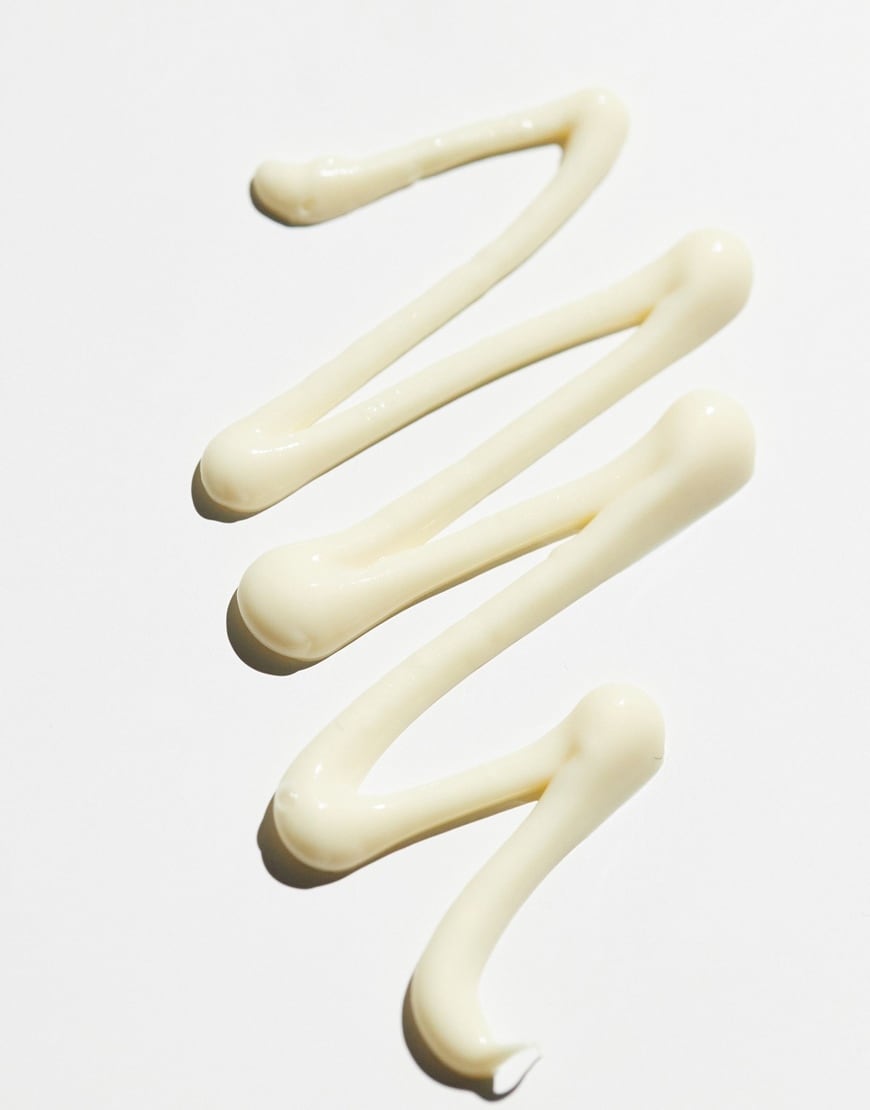 Yellow face cream on white background