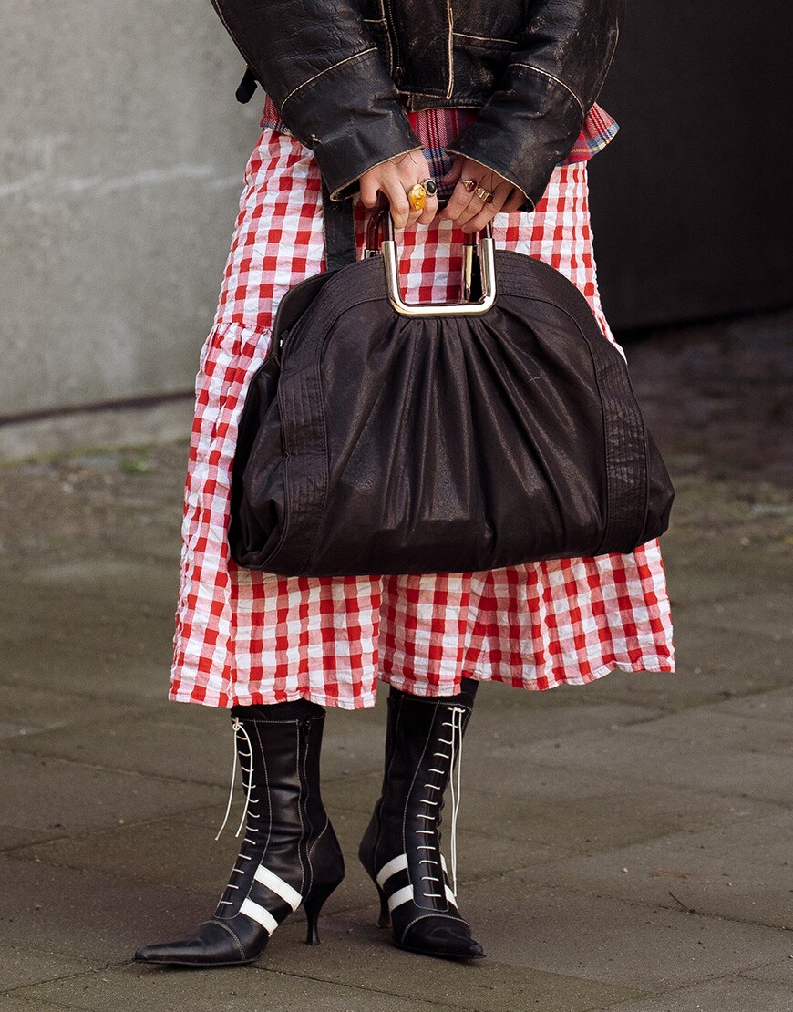 Woman wearing slouchy leather bag | ASOS Style Feed