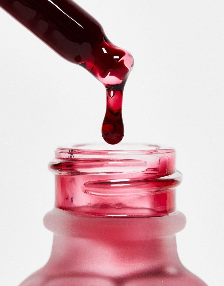 Bottle and dropper with red liquid