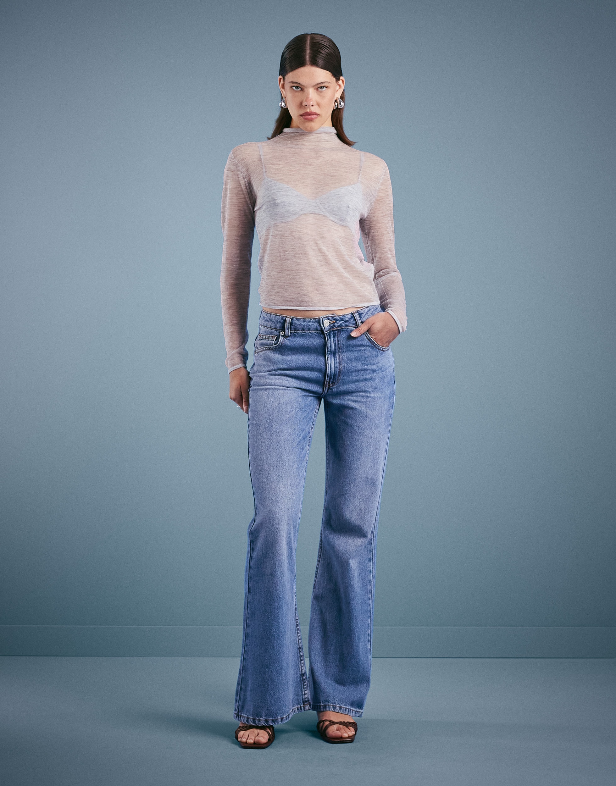 Woman wearing flared jeans | ASOS Style Feed