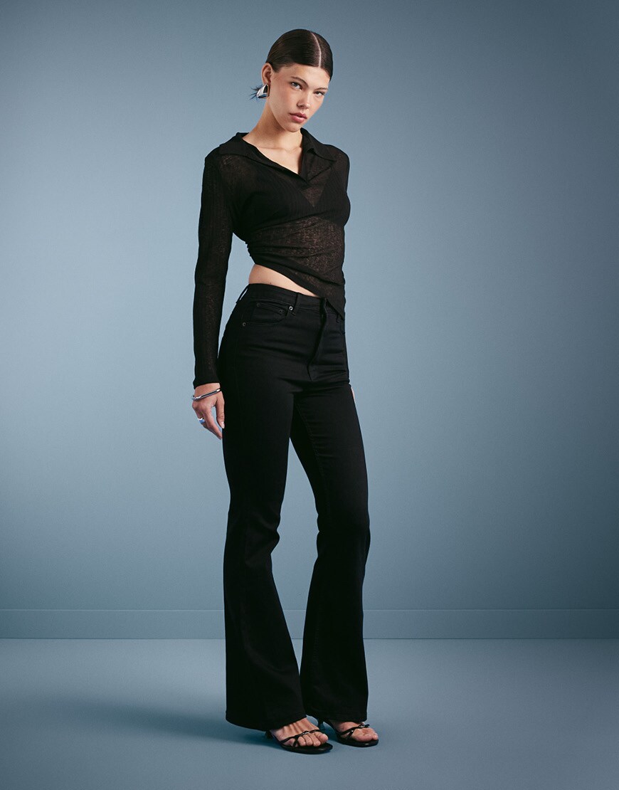 Woman wearing flared jeans | ASOS Style Feed