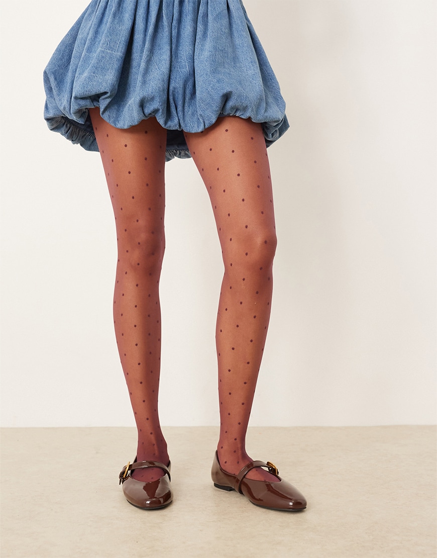 Woman wearing red polka dot tights