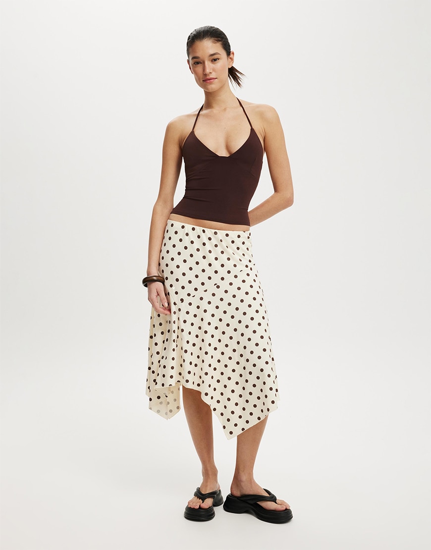 Woman wearing a cream polka dot skirt