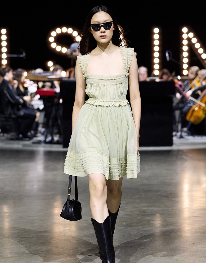 Model wearing AllSaints mini dress | ASOS Style Feed