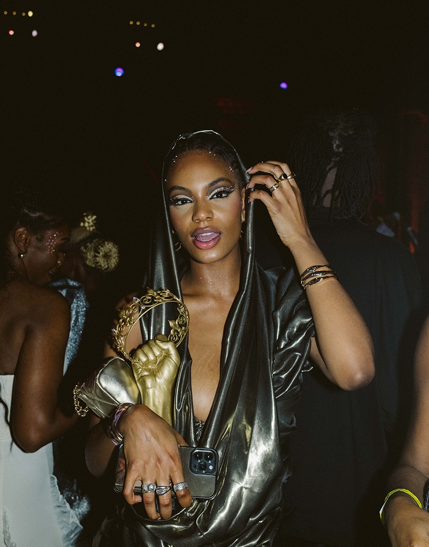 Woman holding a gold trophy