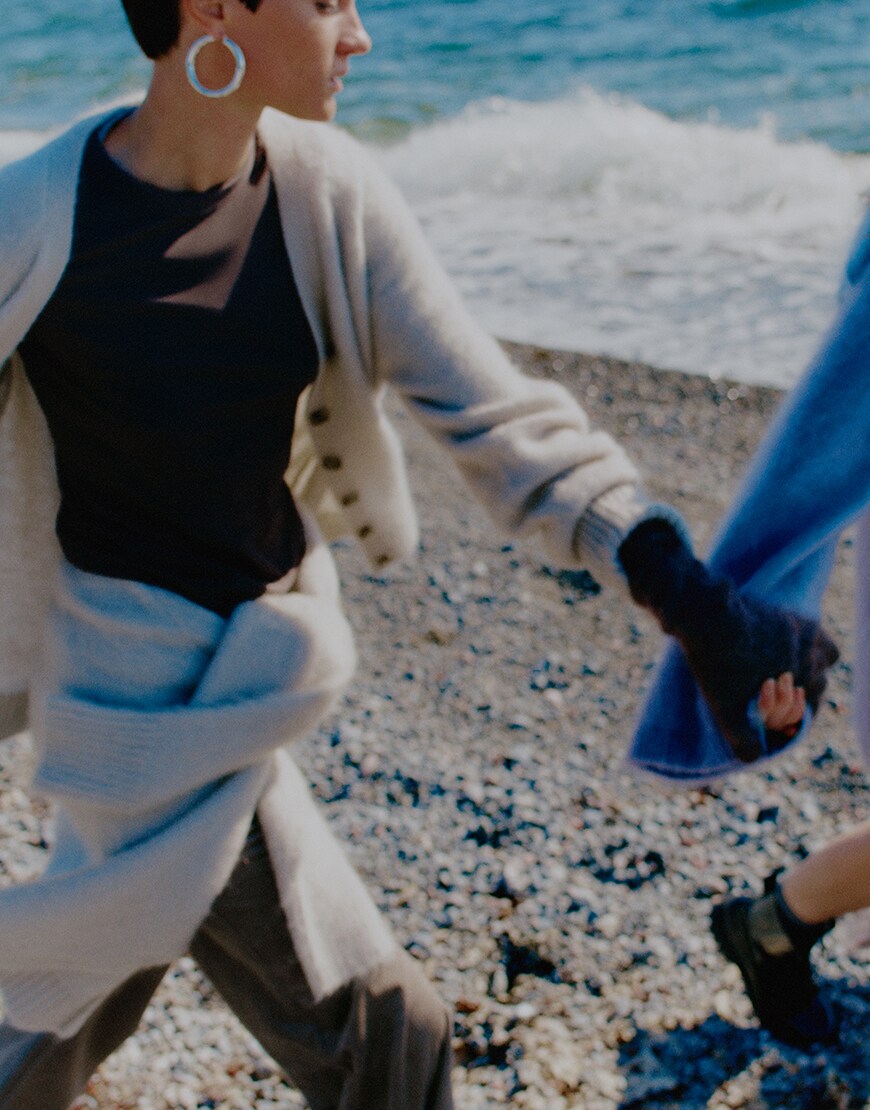 Woman wearing cardigan and silver hoop earrings | ASOS Style Feed