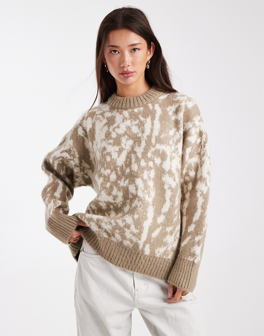 Model wearing a deer-print jumper
