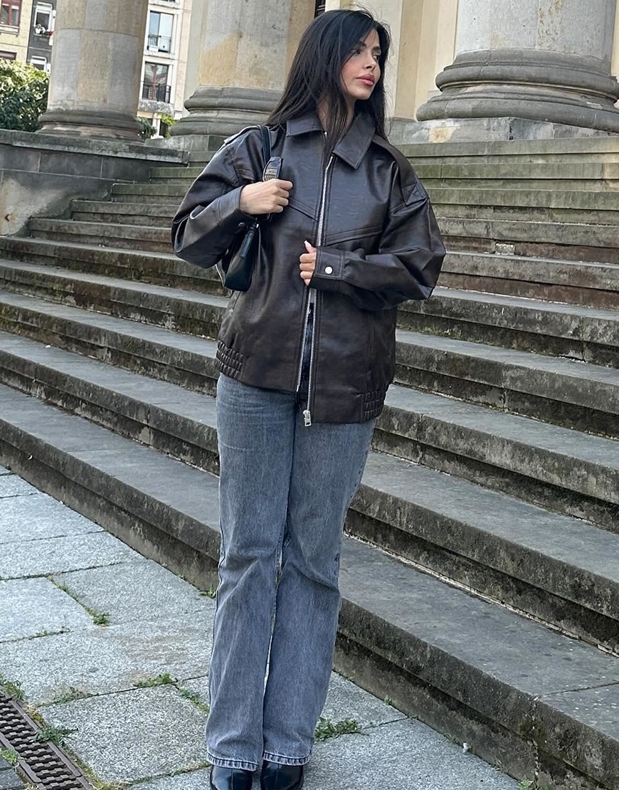 Woman wearing a leather-look coat