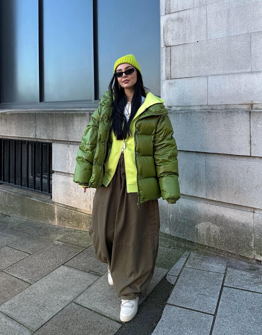 Woman wearing a khaki puffer jacket