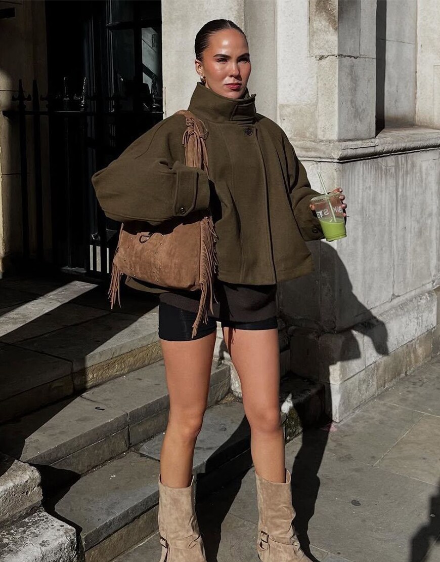 Woman wearing a cape coat