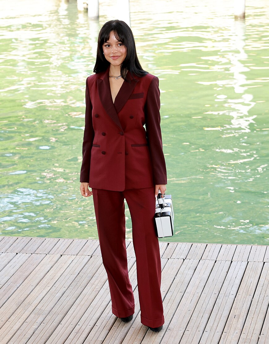 Jenna Ortega wearing a red suit