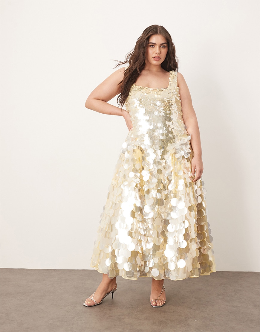 Model wearing a gold sequin dress