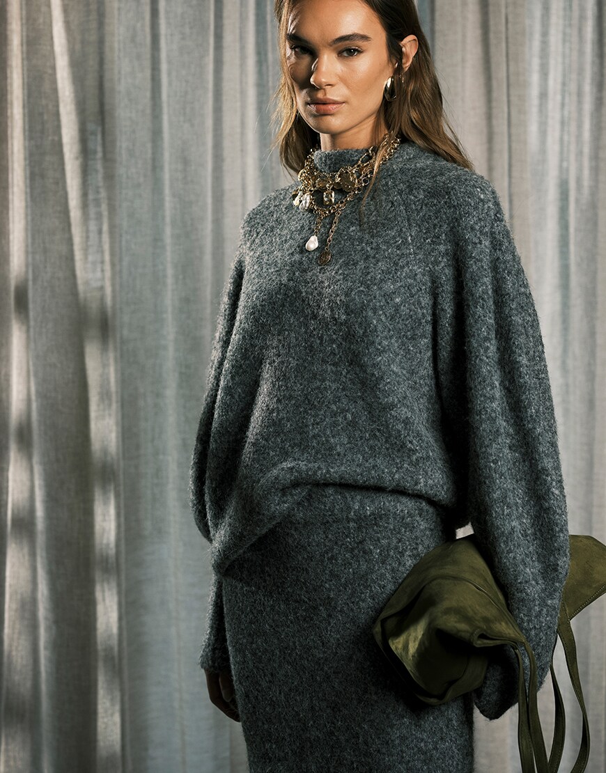 Model wearing a charcoal knit co-ord