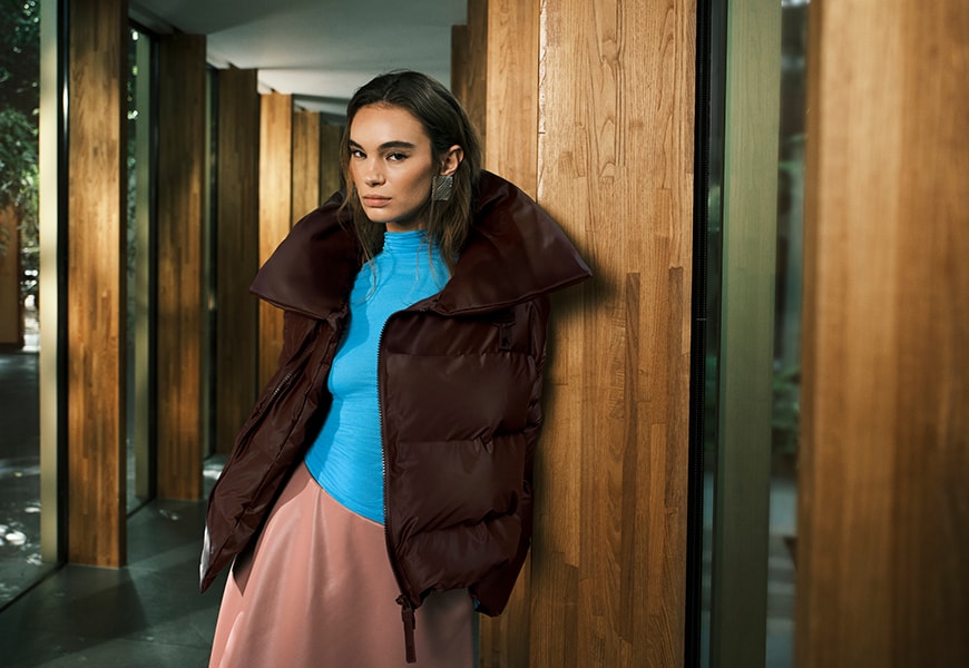 Model wearing a blue turtleneck