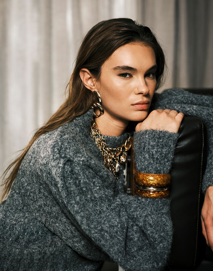 Woman wearing gold bangles