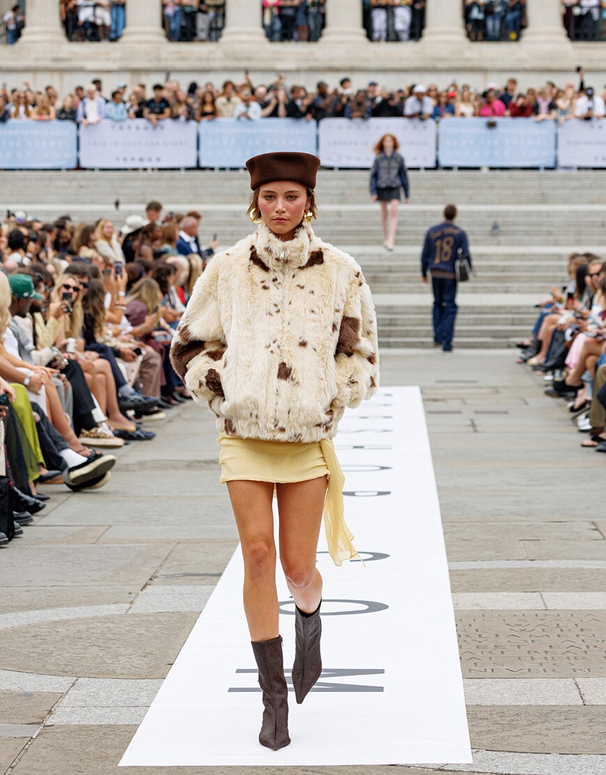 Woman wearing cow print faux fur jacket | ASOS Style Feed