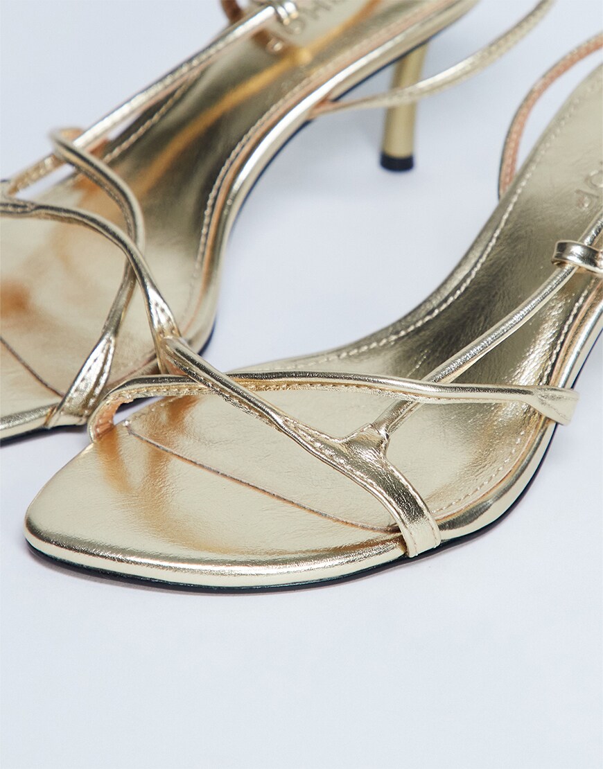 Gold strappy heels