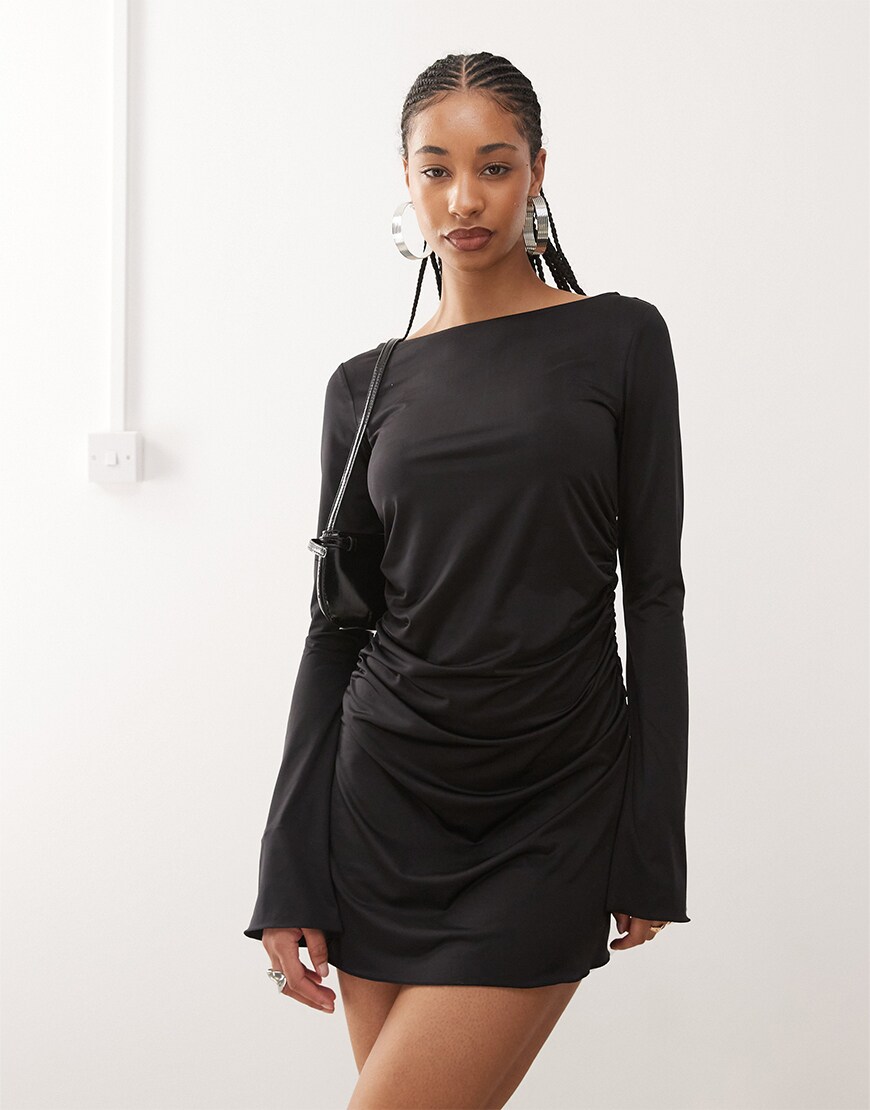 Model wearing a black mini dress