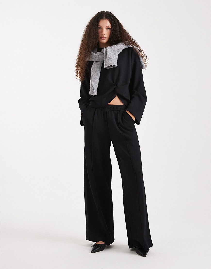 Model wearing a black co-ord