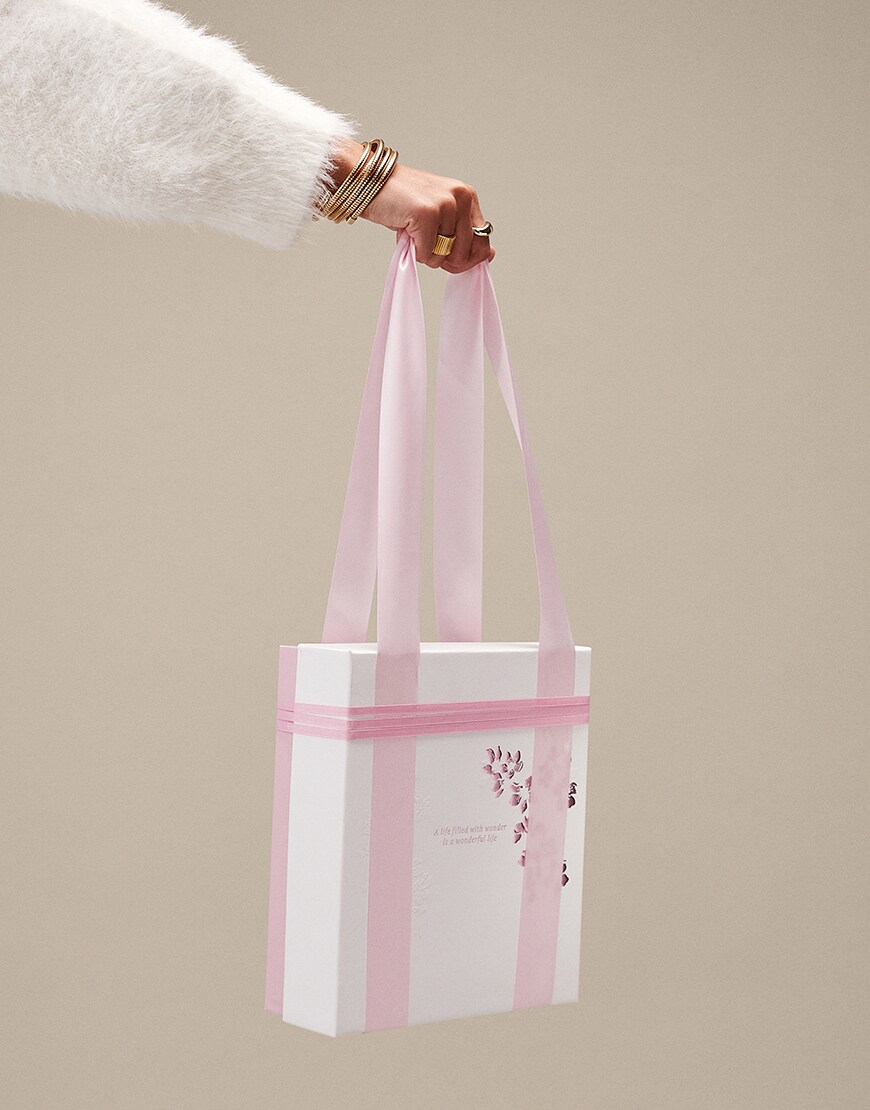 Woman holding Rituals body care gift set | ASOS Style Feed