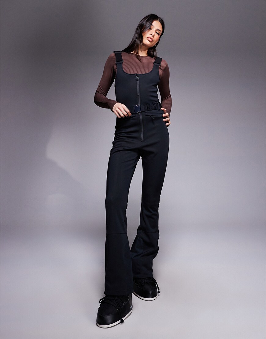 Woman wearing ski salopettes