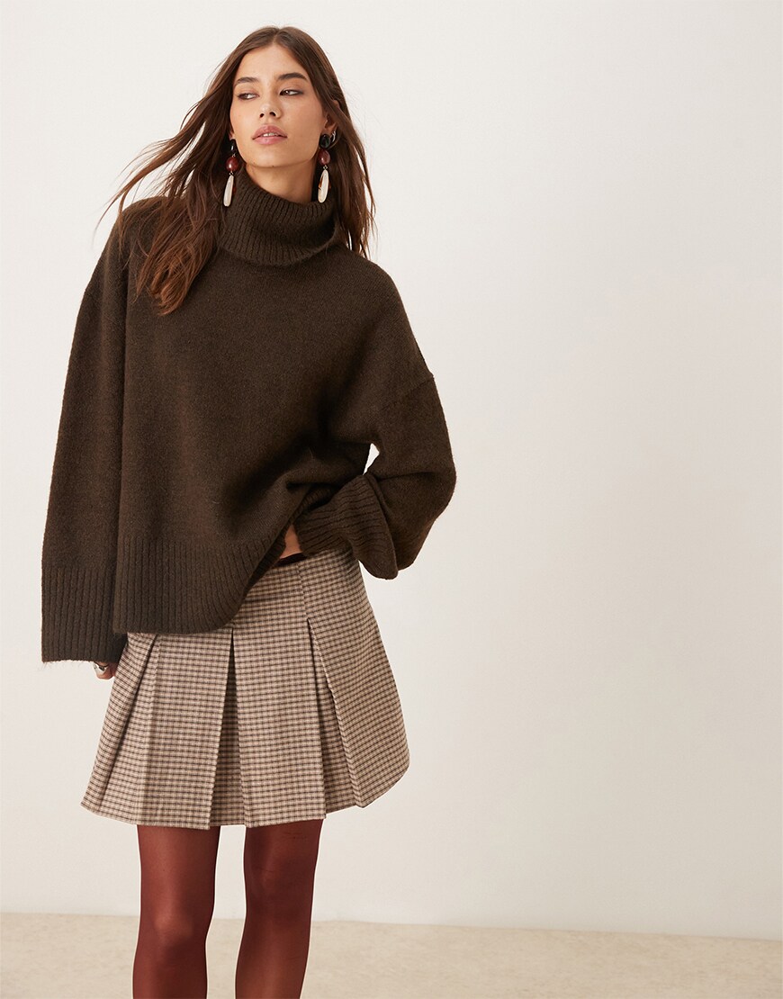 Woman wearing a brown knit jumper