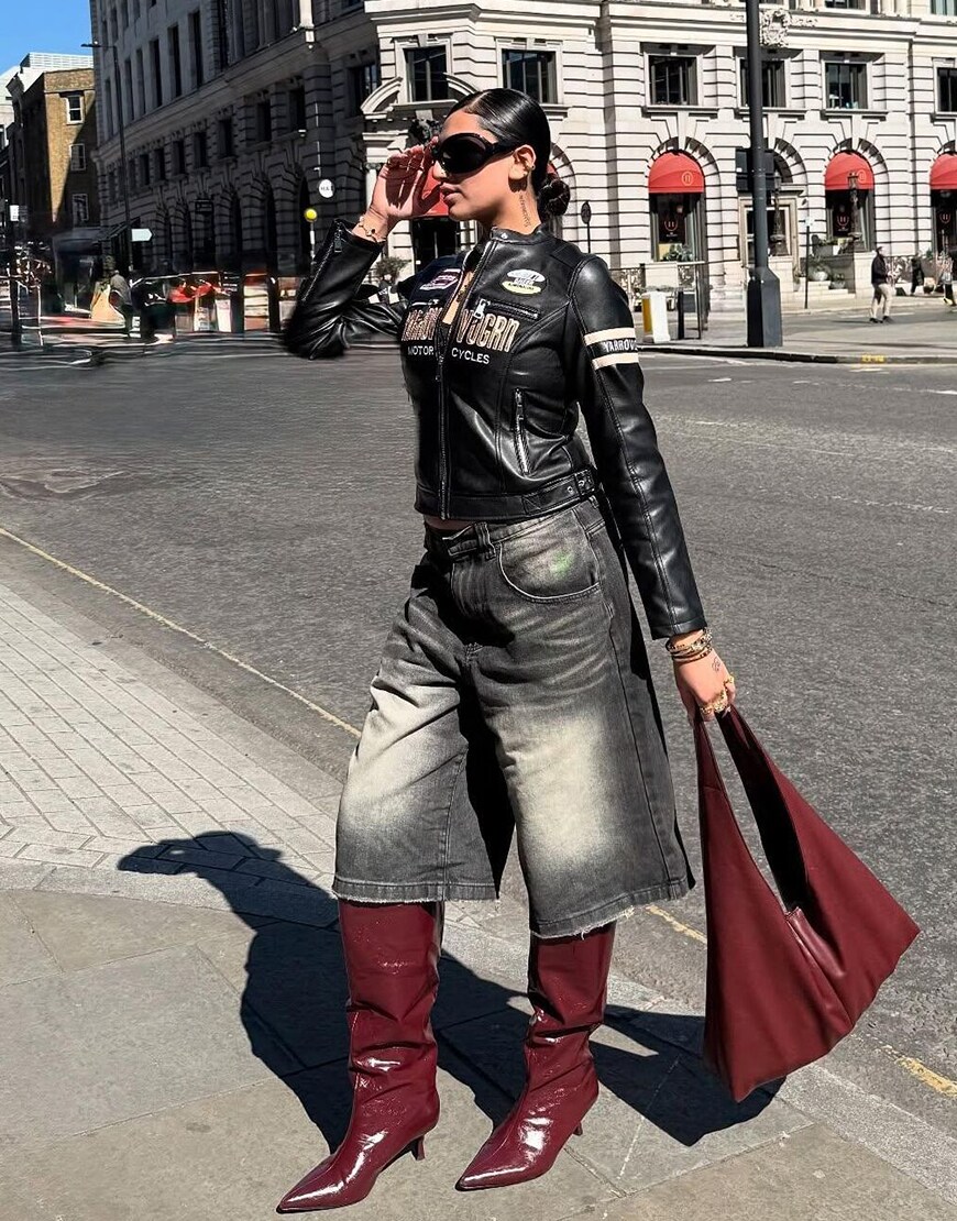 Woman wearing red kitten-heel boots