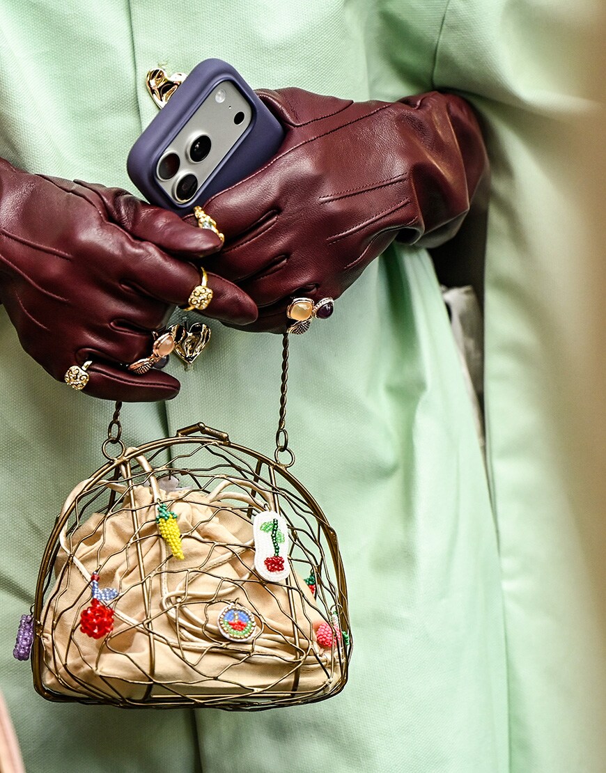 Woman wearing leather gloves and colourful bag | ASOS Style Feed