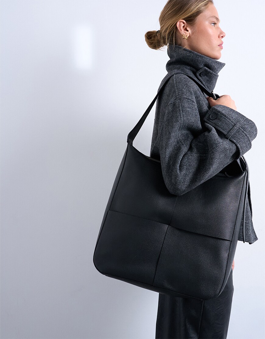 Woman holding a square bag