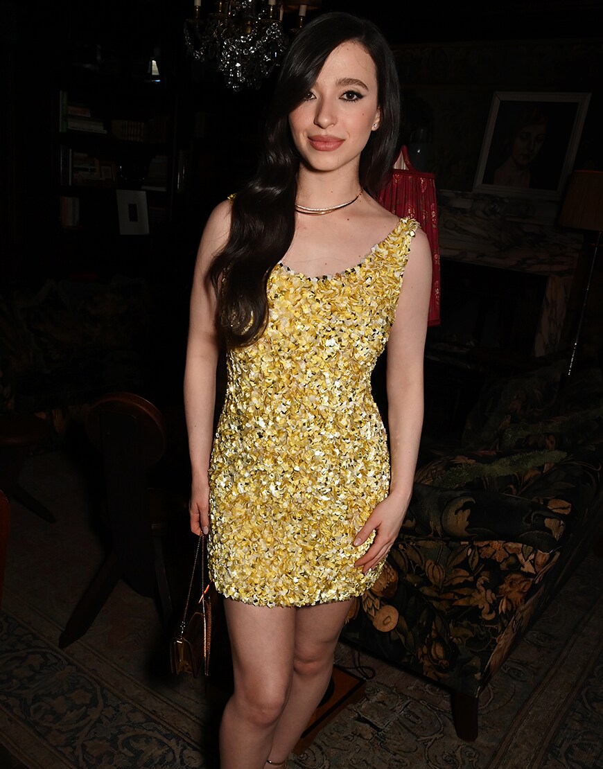 Mikey Madison wearing a gold dress
