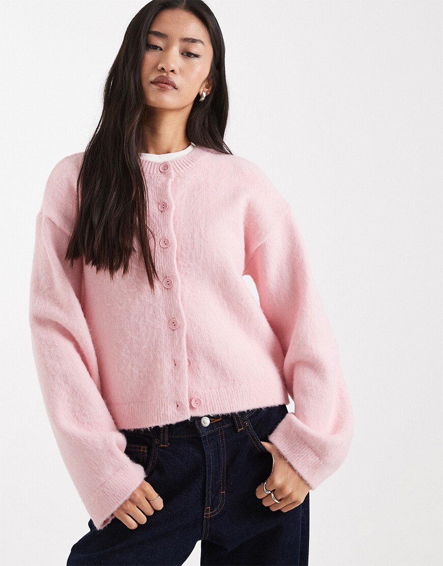 Woman wearing a pink cardigan