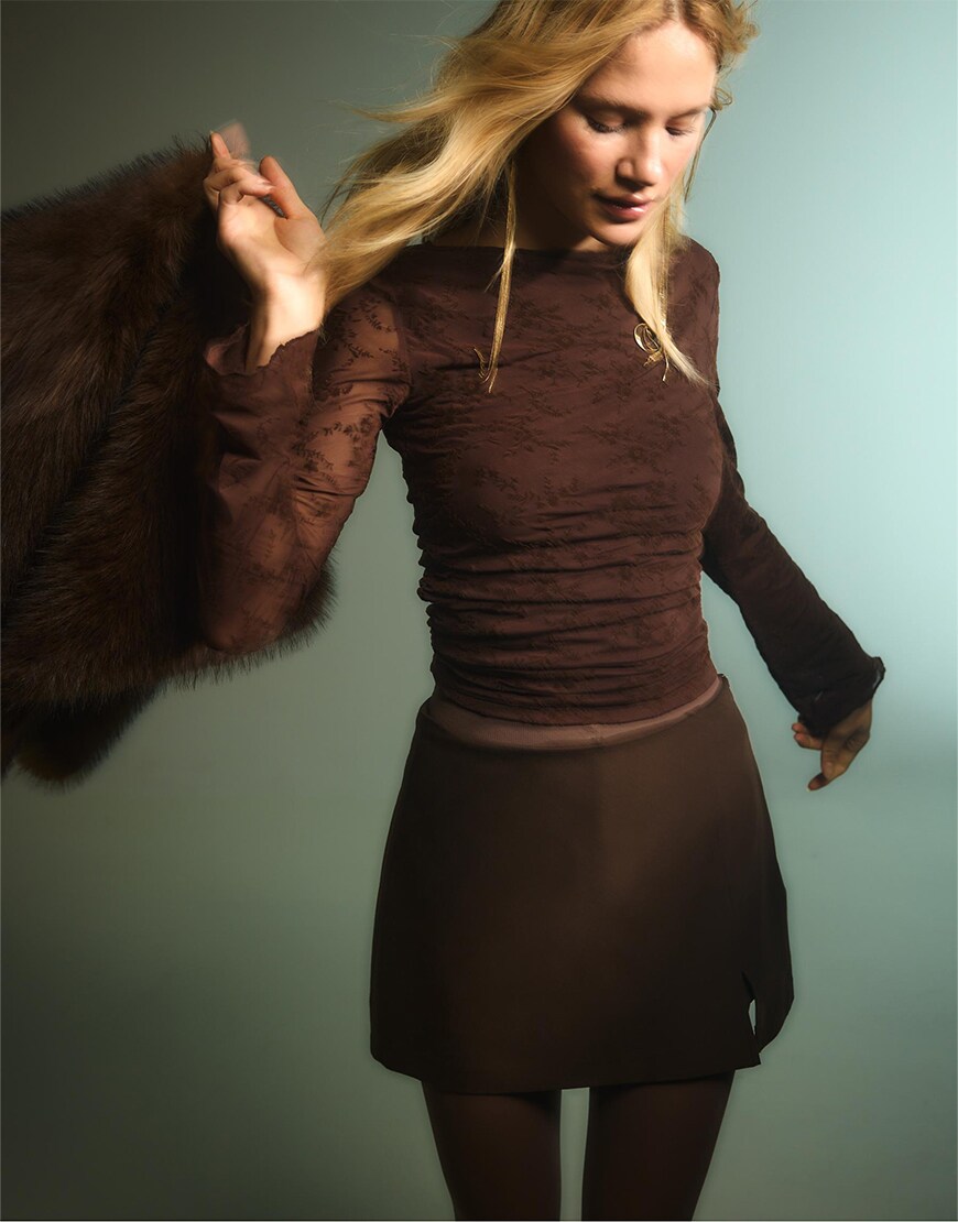 Woman wearing a brown outfit