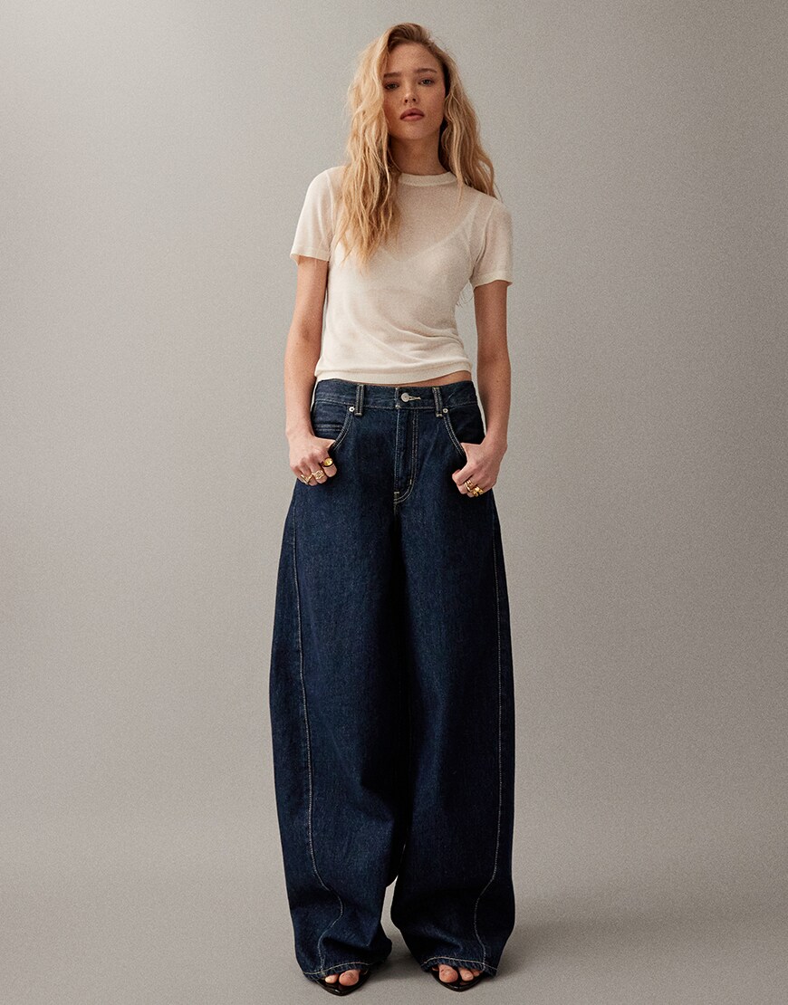 Woman wearing barrel-leg jeans