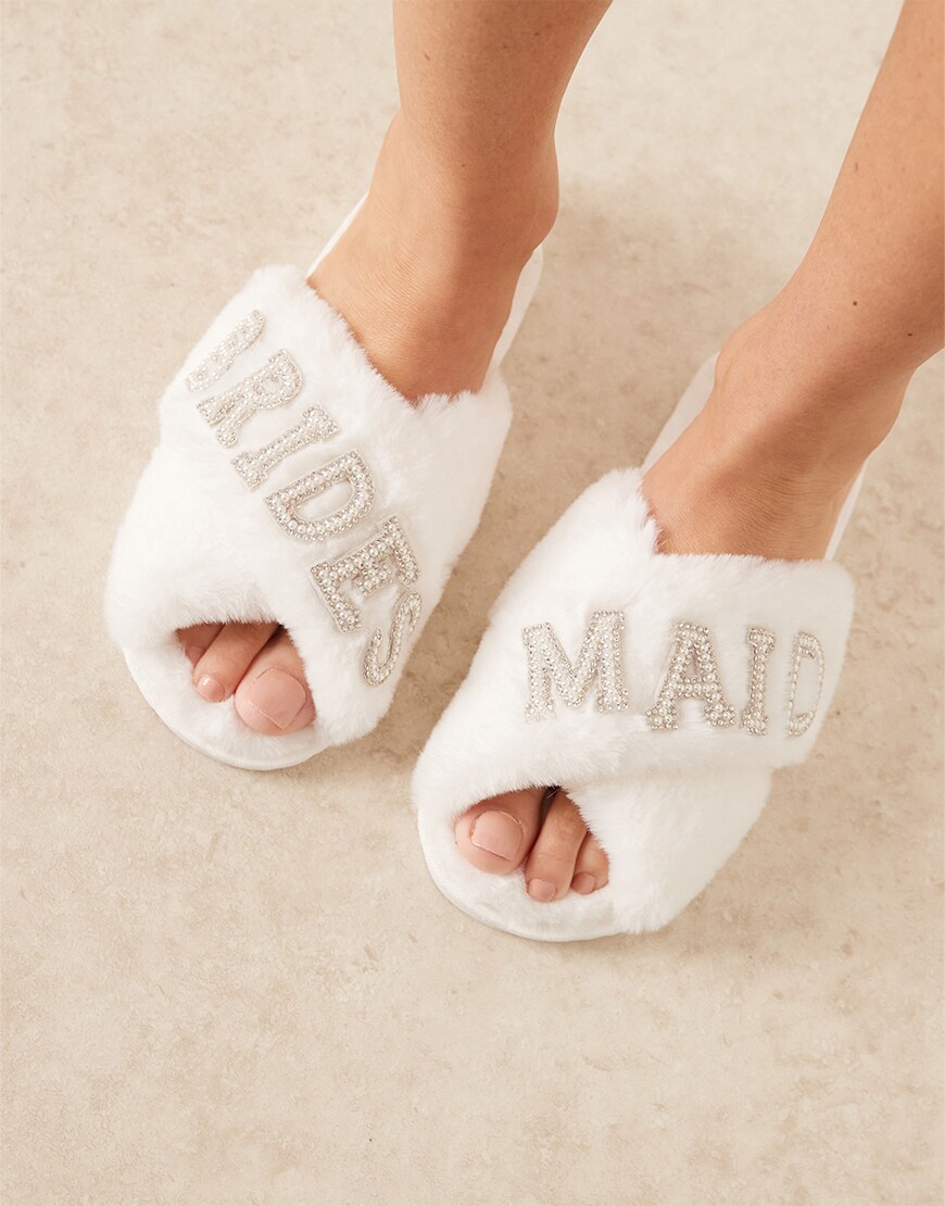 Woman wearing white slippers