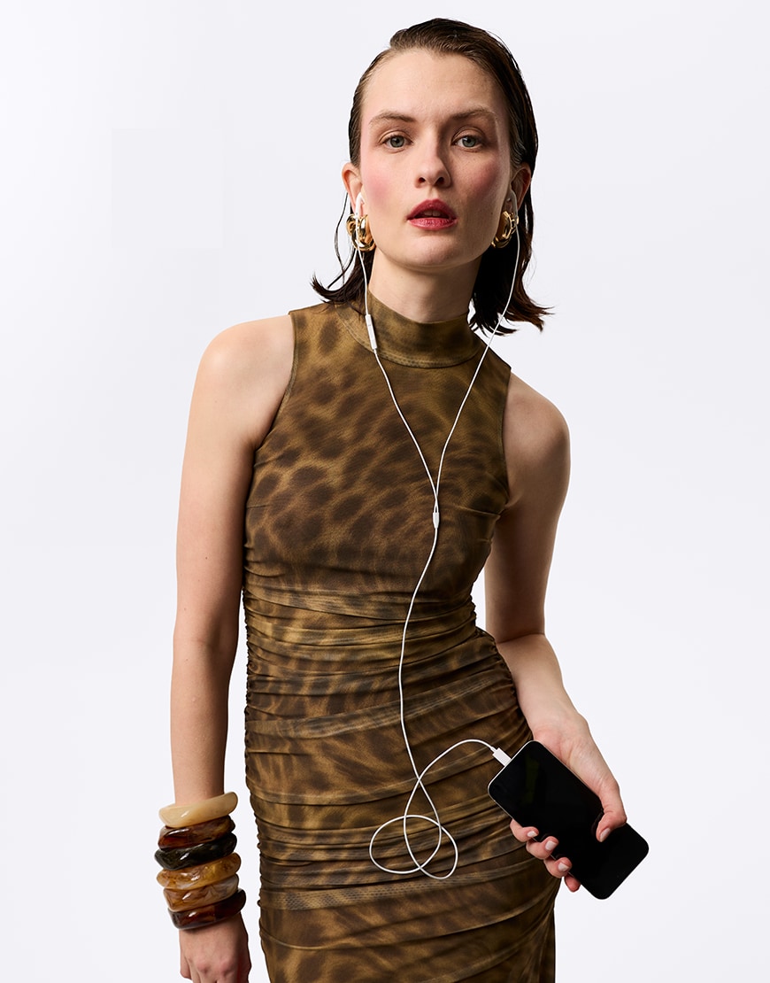 Woman wearing leopard print draped dress | ASOS Style Feed