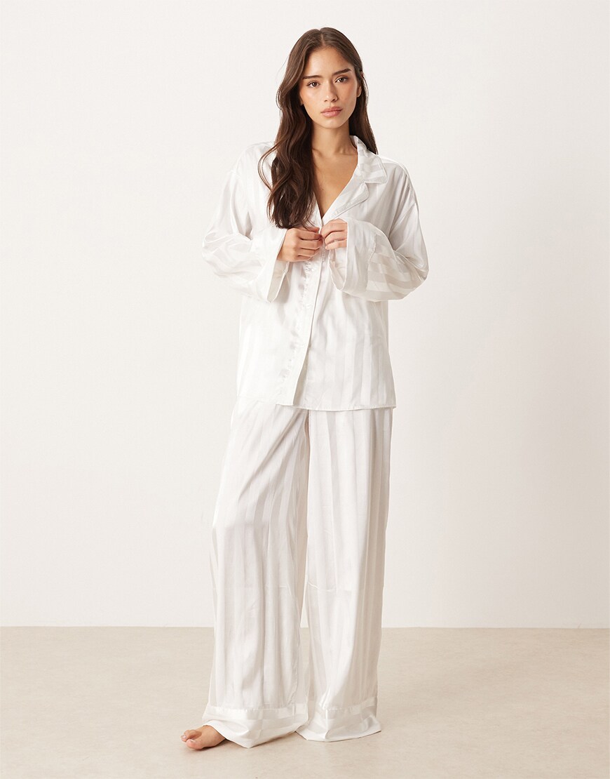 Woman wearing a striped white pyjama set