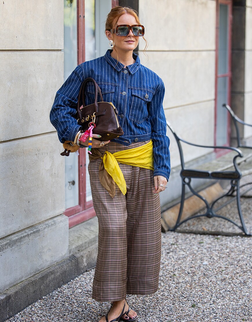 A woman wearing a striped denim jacket at Copenhagen Fashion Week | ASOS Style Feed