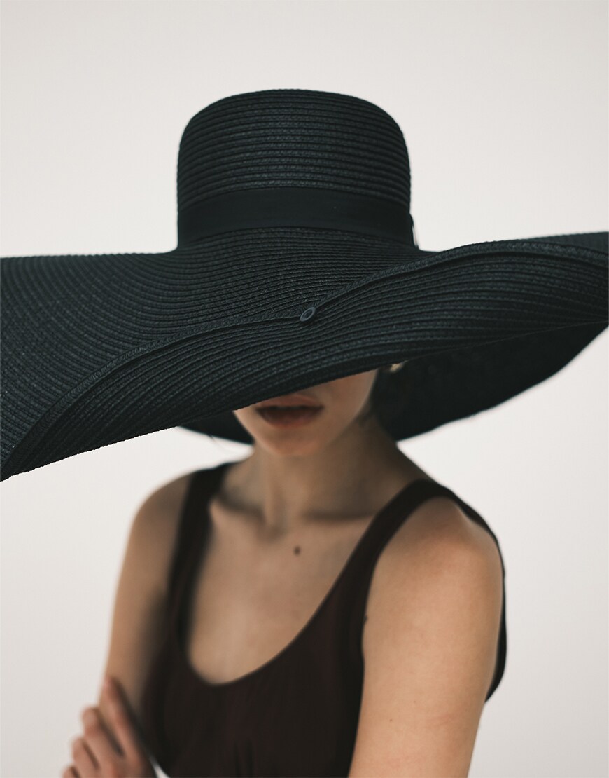 Woman wearing a black hat