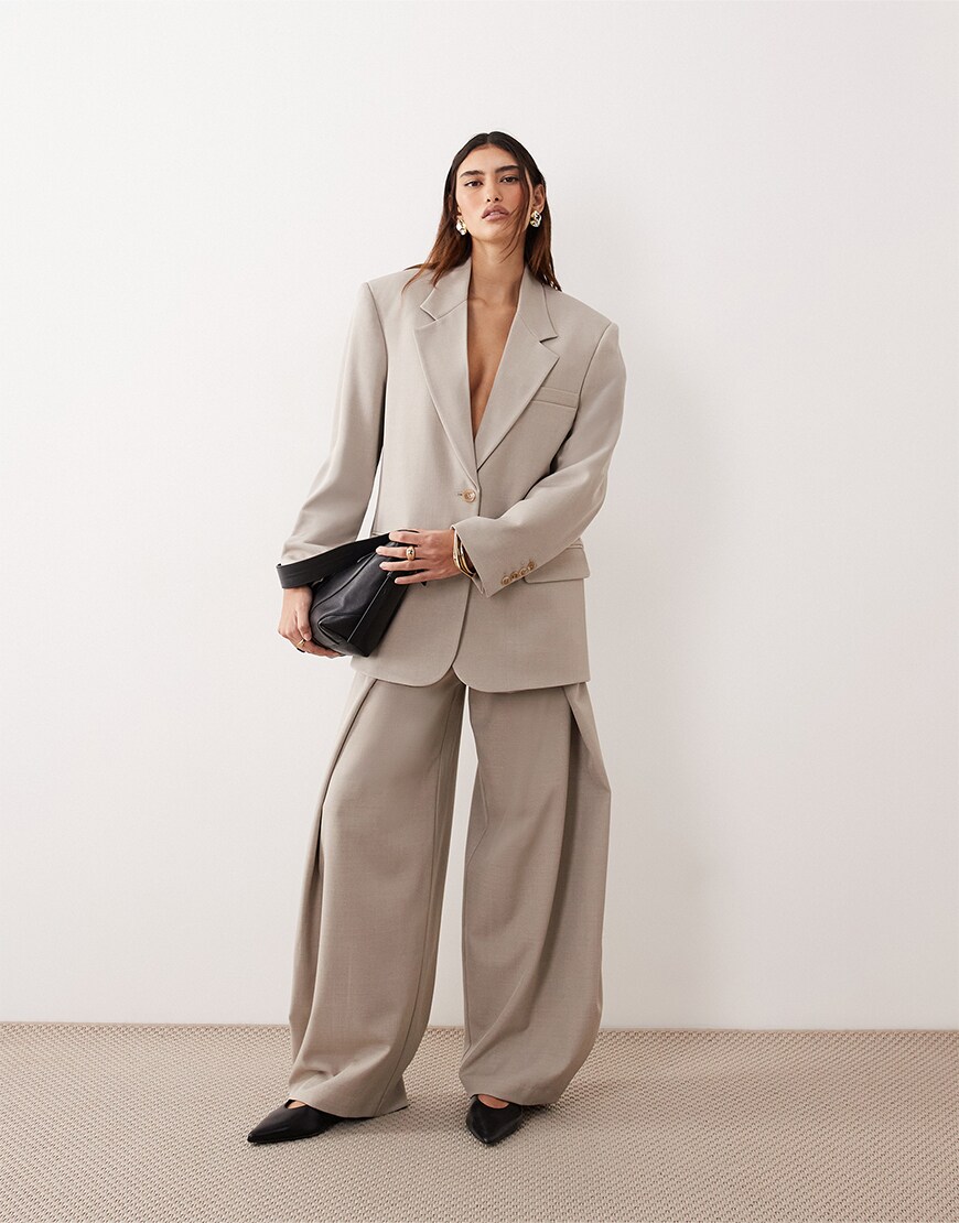 Woman wearing a beige suit